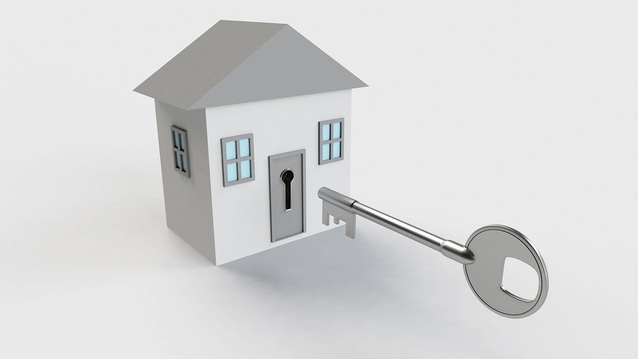 Grafika przedstawiająca mały domek i stosunkowo duży klucz